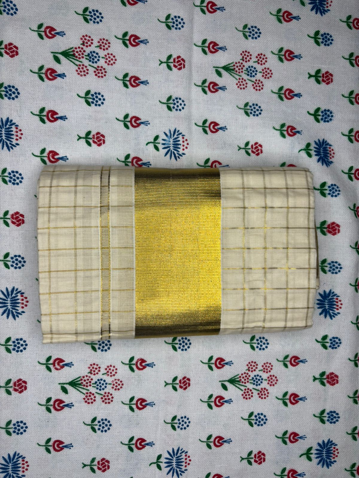 MAT001 Step up your style game with our Cotton Set Mundu featuring 1 inch Checked designs!