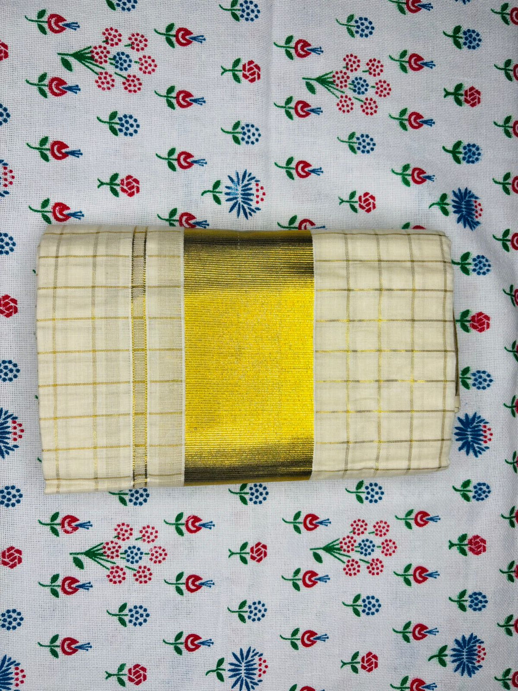MAT001 Step up your style game with our Cotton Set Mundu featuring 1 inch Checked designs!