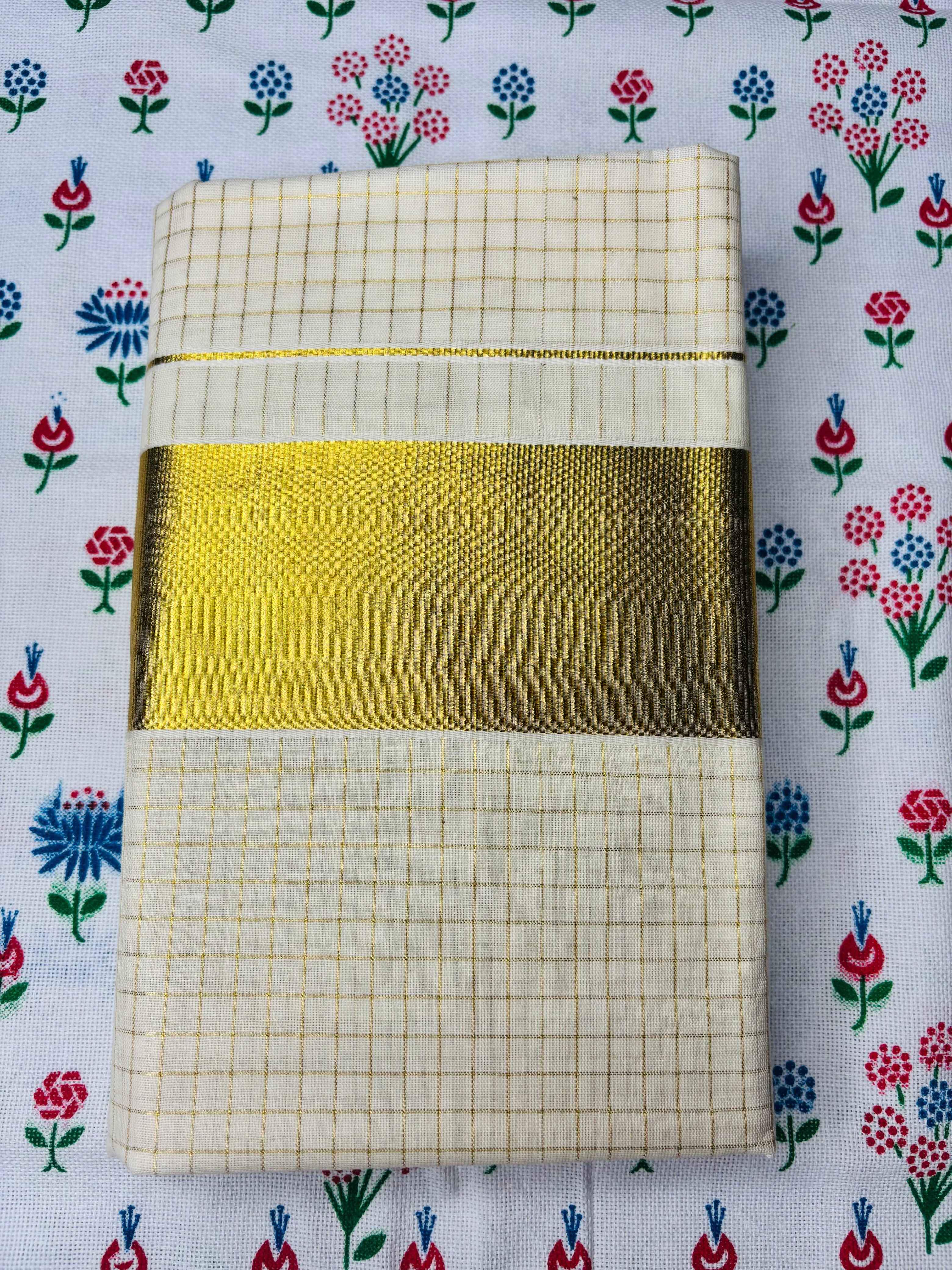 MAT002 Elevate your traditional look with our Cotton Set Mundu featuring small checked designs