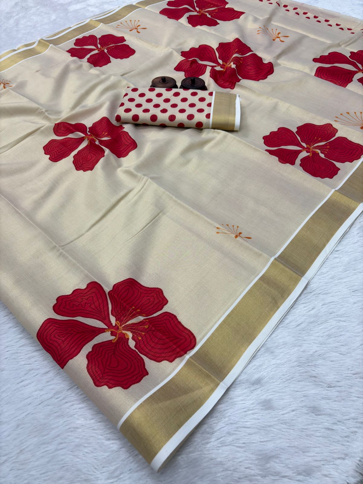 PRD00128  Kerala cotton silk Kasavu saree featuring a golden zari woven border and striking ikkat-style digital print