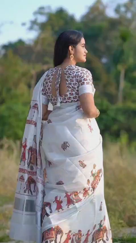 MAT0012  Exquisite Kerala Mural Saree Paired with a Running Print Blouse.